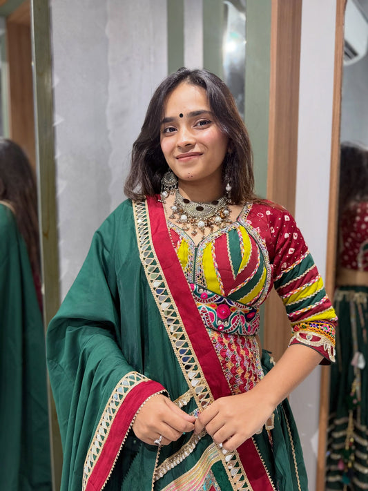 Designer Green Chaniya with Intricate Mirror Work Border, Paired with a Long Red Kedia-Style Bombay Silk Blouse Embellished with Authentic Vintage Kutchi Mirror Work