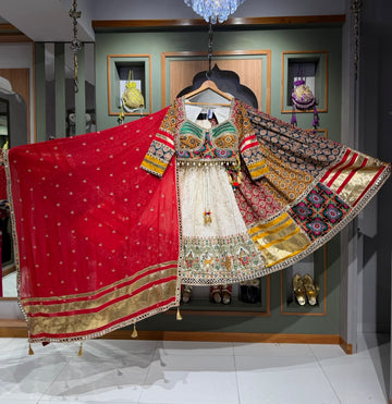 Designer White Ajrakh Chaniya Choli with Kutchi Mirror Work, Kodi Work & Red Dupatta