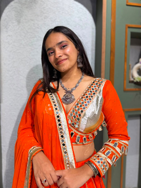 Orange Georgette Tikki Chaniya Choli with Mirror & Lappo Border Navratri Chaniya Choli