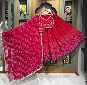 Rani Pink Bandhani Chaniya Choli with Mirror Border & Rayon Dupatta