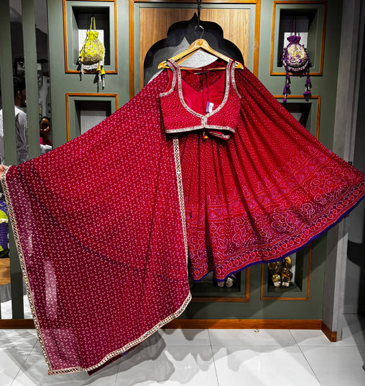 Rani Pink Bandhani Chaniya Choli with Mirror Border & Rayon Dupatta