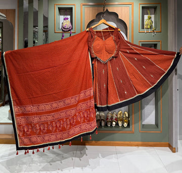 Designer Rust Orange Ajrakh Chaniya Set with Real Mirror & kodi Shell Work